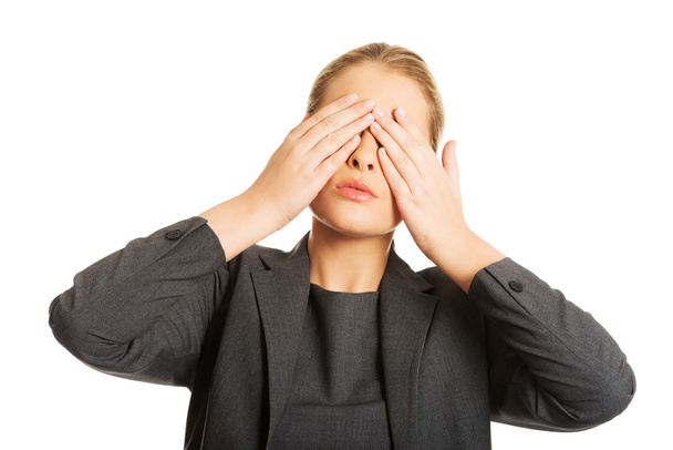 Woman covering her face with both hands - Photo, Image