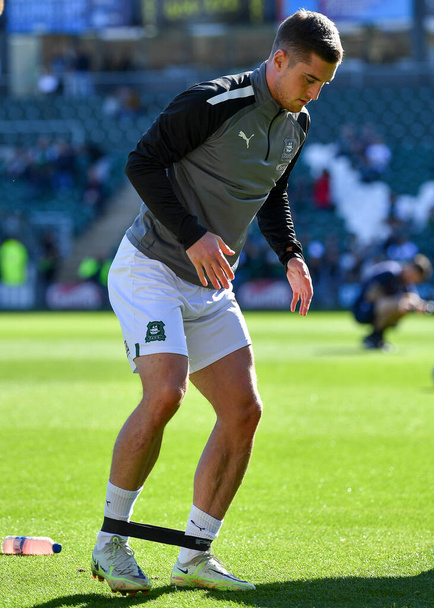 Plymouth Argyle midfielder Conor Grant (15) warming up  during the Sky Bet League 1 match Plymouth Argyle vs Accrington Stanley at Home Park, Plymouth, United Kingdom, 8th October 202 - Fotografie, Obrázek