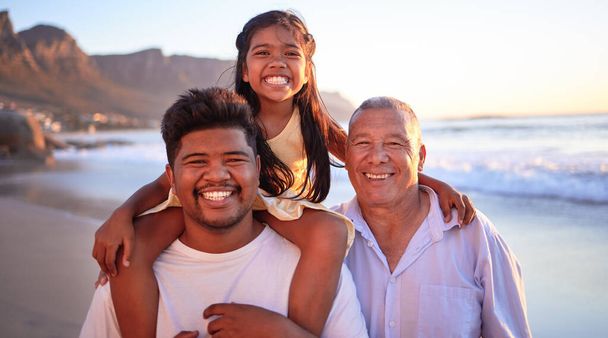 Family smile while on beach summer vacation in Indonesia during sunset. Happy father, grandfather and girl enjoy a travel holiday with tropical weather, love and happiness while bonding together. - Photo, image