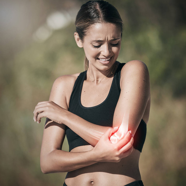 Workout woman and elbow pain from injury in joint and physical trauma from intense exercise. Athlete girl with painful, injured and broken bone from fitness training holding arm for support - Zdjęcie, obraz
