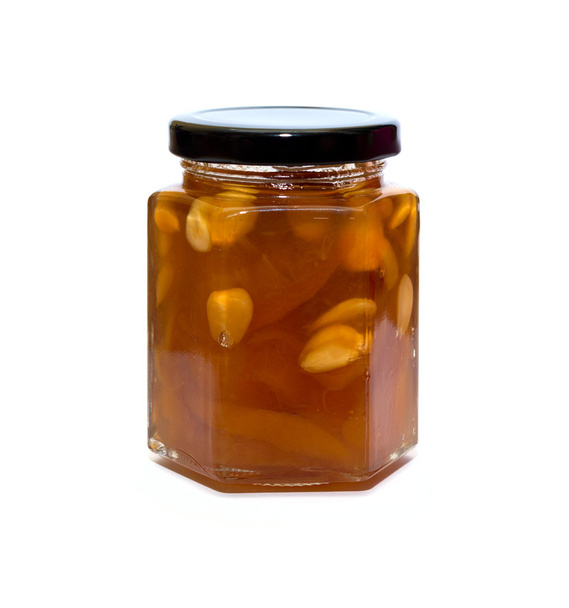 Vasetto di vetro marmellata di pesche riflesso su sfondo bianco
 - Foto, immagini