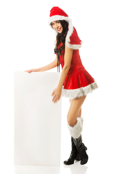Santa woman holding white empty banner - Фото, зображення
