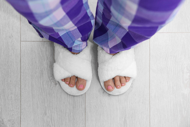 Woman wearing white soft slippers, top view - Fotografie, Obrázek
