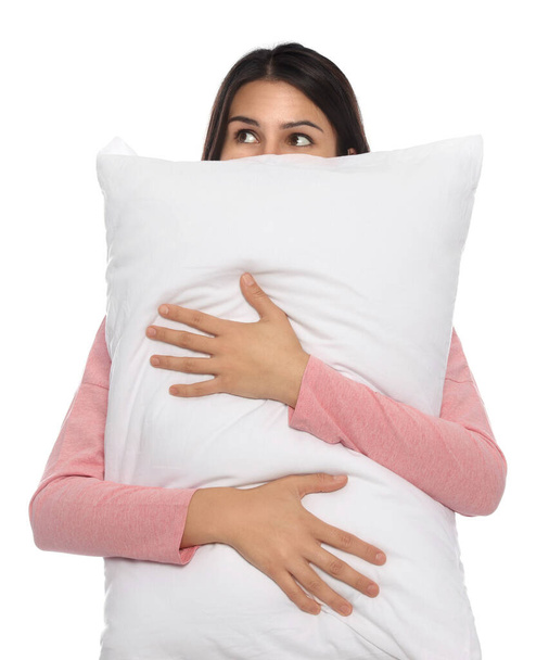 Young woman covering face with pillow on white background - Foto, Imagem