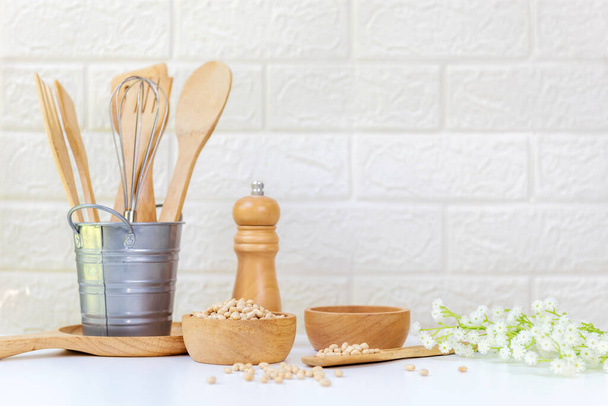 Kitchen tools and kitchenware utensil object with ingredients and mix nut on kitchen shelf wood white for healthy eat and health care life.  Wall white brick background - 写真・画像