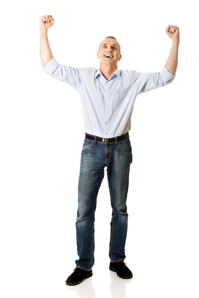 Full length cheerful man with hands up - Valokuva, kuva