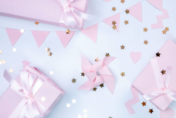  background with pink ornaments and gift boxes, decorative, delicate, background. concept of a party or birthday party in pink colors or a newborn baby girl.  - Φωτογραφία, εικόνα