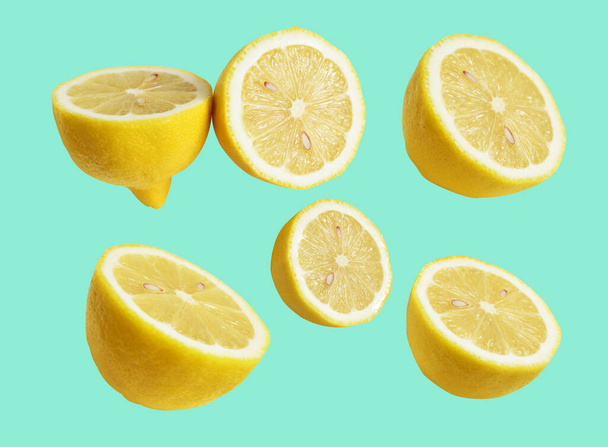 Fresh yellow lemon fruit isolated with clipping path, no shadow, pieces, half, slices in green background - Фото, зображення