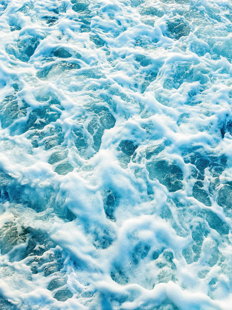 Vertical abstract background. Top down aerial view of sea water surface. White foam waves texture as natural background - Photo, image