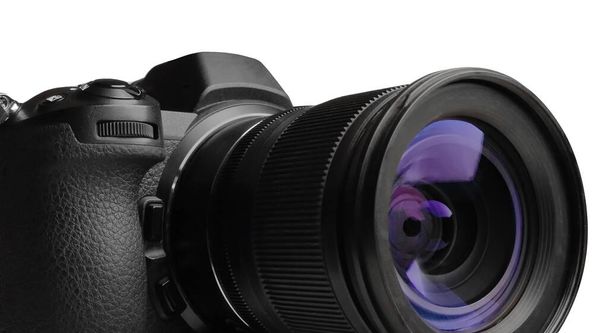 Modern mirrorless camera with zoom lens on white background closeup - Photo, Image