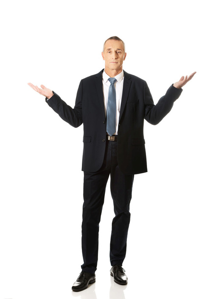 Full length businessman in undecided gesture - Фото, зображення