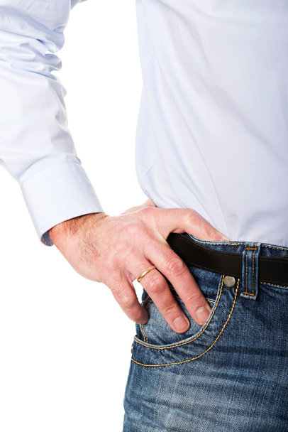 Close up man wearing jeans with hand on hip - 写真・画像