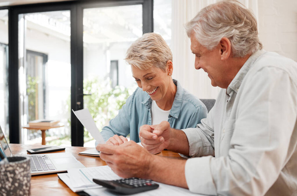 Senior couple, finance and investment or paying their bills at home. Married man and woman use calculator, checking their budget and retirement plan. Smiling mature people planning for future pension. - Foto, Bild