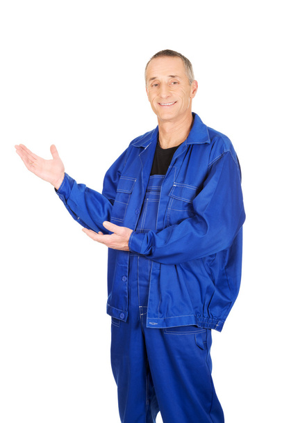 Smiling repairman showing copy space - Photo, image