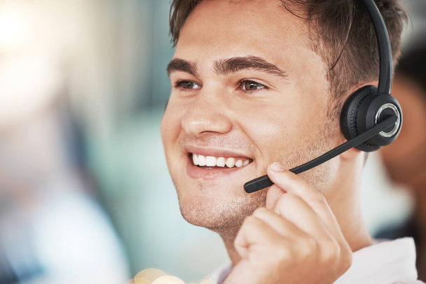 Call center, happy sales man and customer service worker consulting, microphone telemarketing and working in office. Face of smile contact support consultant, crm communication and agency help desk. - Photo, Image