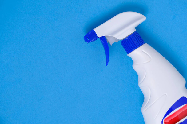 Sprayer for washing windows and plumbing blue background - Valokuva, kuva
