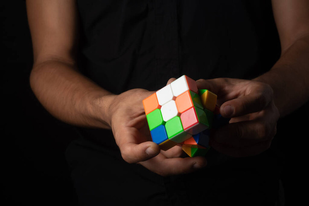 Close up portrait of  Rubik cube ,on black background - 写真・画像