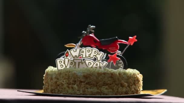Birthday cake with motorcycle figure - Footage, Video