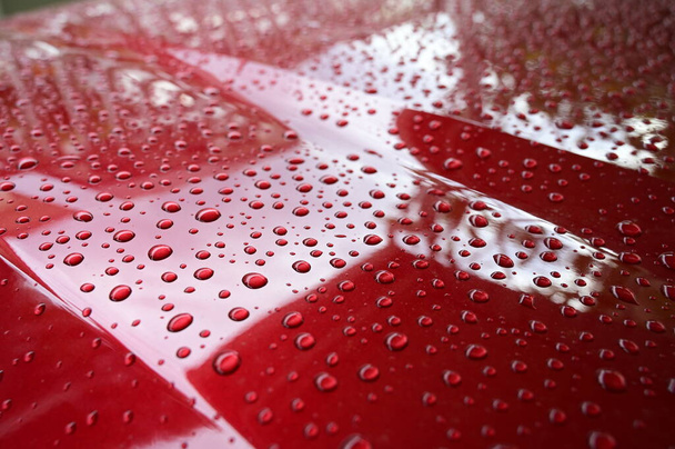 water on red hood car, transportation background - Фото, изображение