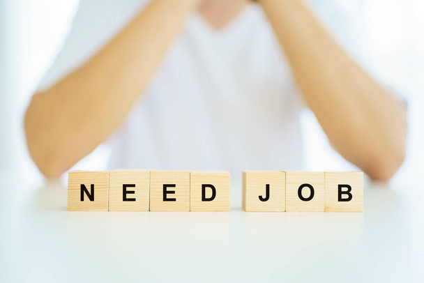 Unemployment people showing the word "need job" on the wooden blocks. - Foto, imagen