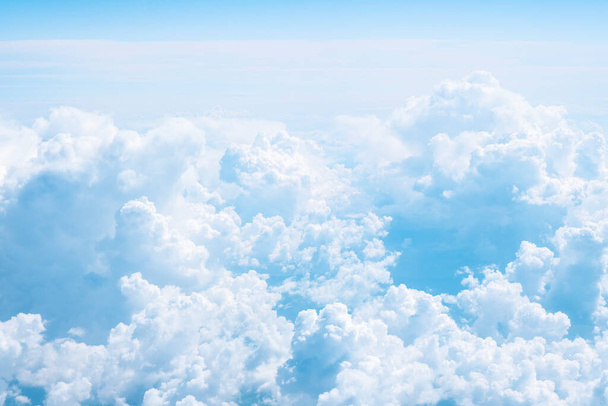 Beautiful soft blue cumulus clouds. Background with copy space. Aerial view. - Photo, Image