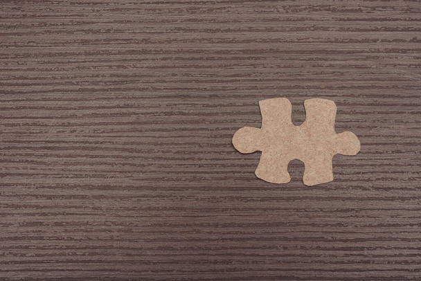 puzzle pieces on wooden background - Fotó, kép
