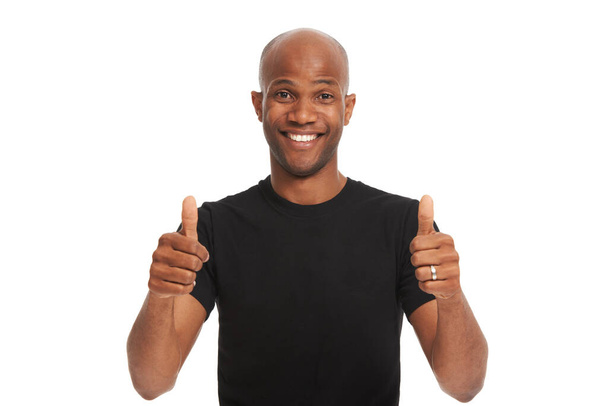 Youre doing great. Studio portrait of a handsome african american man giving the thumbs up isolated on white - Foto, imagen