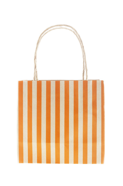 茶色の紙バッグ オレンジ ストライプ白で隔離  - 写真・画像