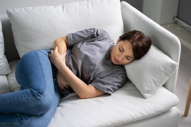 Women With Stomach Ache. Diarrhea Or PMS Pain - Photo, Image