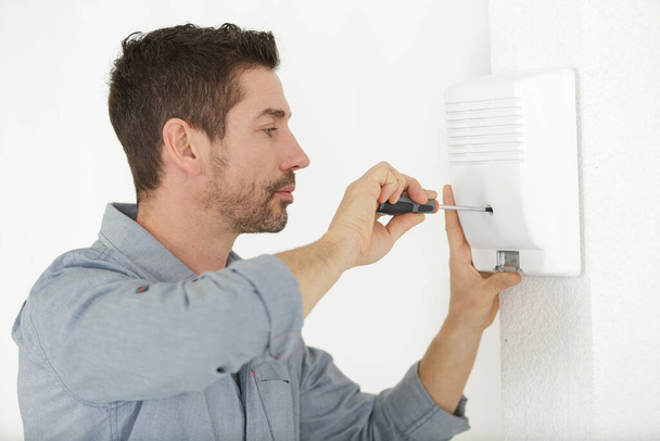 electrician fixing electric panel in private home - Foto, immagini