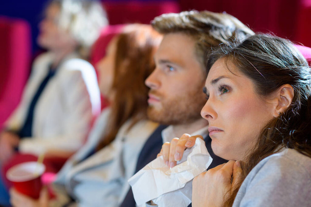 woman crying watching sad film at the movies - Foto, imagen
