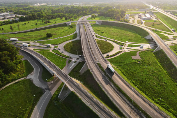 Aerial view of cars driving on round intersection in city, Transportation roundabout infrastructure, Highway road junction in Wroclaw, Poland - Photo, image