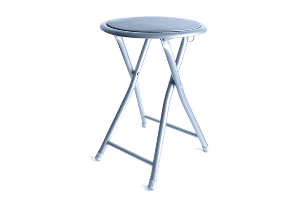 Padded gray foldable stool isolated on white background. - 写真・画像