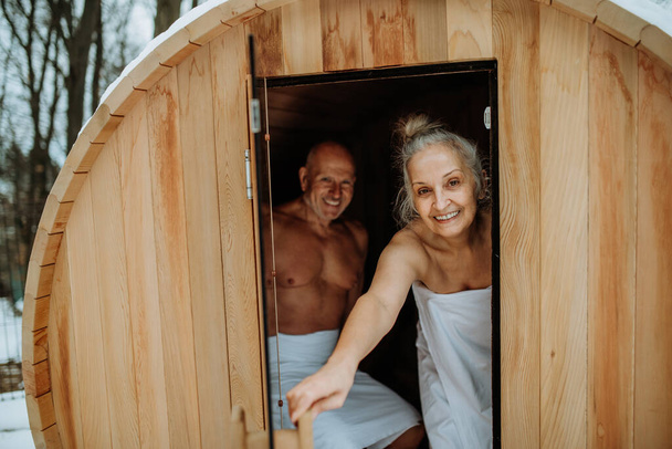 Senior couple enjoying together time in sauna, relax, spa and healthy lifestlye concept. - Foto, immagini