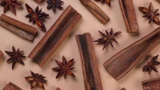  Rotation background with cinnamon sticks and anise stars on a beige background, cozy food, spicy trendy background. High quality 4k footage - Footage, Video