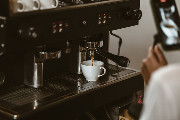espresso machine in coffee shop counter offering freshly brewed coffee. coffee maker concept. - Zdjęcie, obraz
