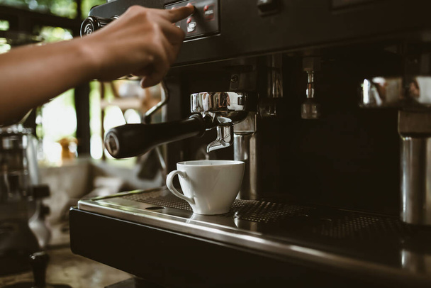 espresso machine in coffee shop counter offering freshly brewed coffee. coffee maker concept. - Foto, Bild