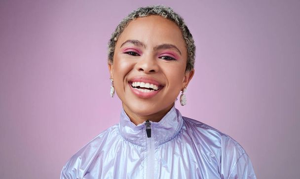 Happy black woman, neon fashion and portrait of creative, cyberpunk and retro, bold and colorful makeup, clothes and cosmetics on studio background. Unique, vaporwave and smile gen z model influencer. - Foto, afbeelding