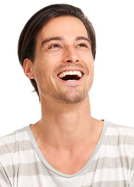 Lighten up and let yourself laugh. Closeup of a young man throwing his head back with laughter, isolated on white - copyspace - Fotoğraf, Görsel