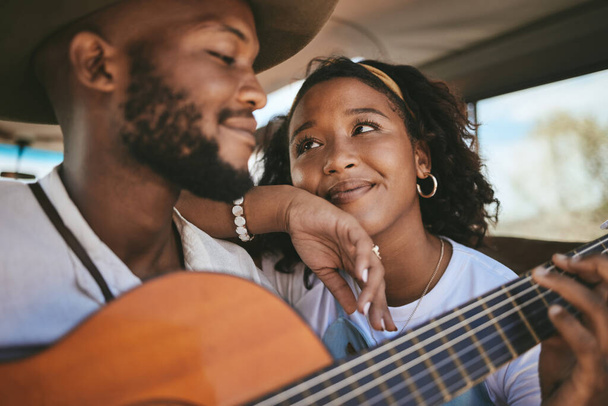 Road trip, guitar and black couple enjoy freedom music on adventure drive and travel on summer vacation having romantic song moment. Love of man and woman with instrument on motor transport getaway. - 写真・画像
