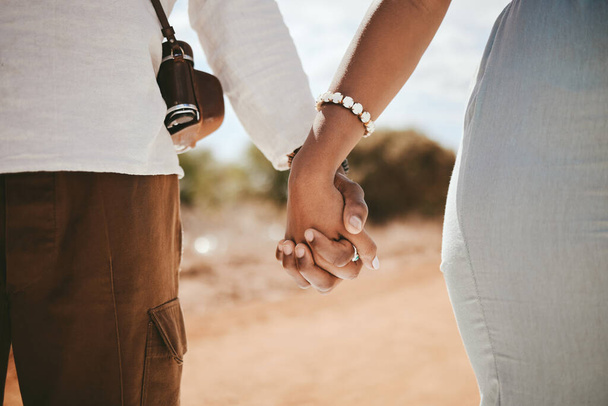 Hand holding, couple and black people travel together on a road trip ready for a safari holiday. Support, trust and vacation love of people hands united in nature in the summer sunshine. - Φωτογραφία, εικόνα