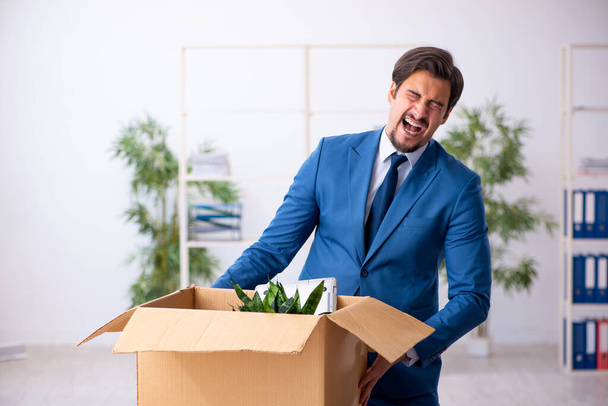 Young businessman employee in business relocation concept - Photo, Image