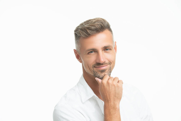 face of positive unshaven guy in white shirt. portrait of unshaven guy style. studio shot of unshaven guy face. mature unshaven guy portrait isolated on white background. - Foto, afbeelding
