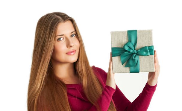 Christmas holiday present, happy woman holding a gift or luxury beauty box subscription delivery isolated on white background, portrait - Фото, изображение