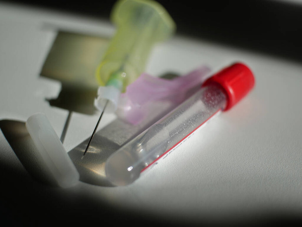 Needle and pump body for blood sampling, light and shadow effect. - Photo, Image