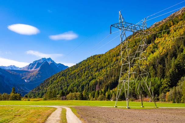 Electricity pylons, in a mountain place. Origin, transport and need for electricity. Environmental defacement. Eletricity grid. - Photo, Image