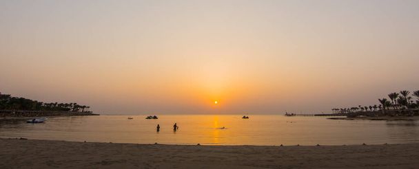 snorkeling after a warm sunrise at the beach in egypt panorama view - Photo, Image