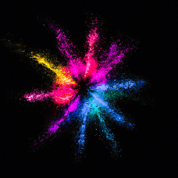 colorful powder explosion on black background. colored cloud. - Photo, Image