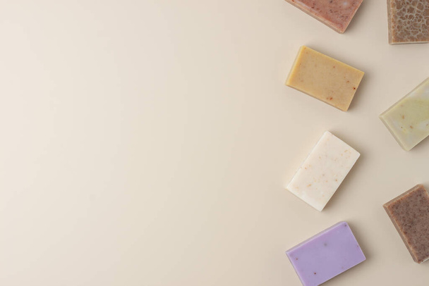 Soap on beige background. Flat lay, copy space. - Photo, image