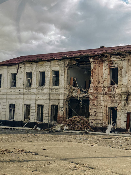 Destroyed building as a result of Russian bombardment in liberated from occupation Kupiansk town in Kharkiv region in Ukraine. Concept of war, Russian invasion and military crimes. - Photo, Image